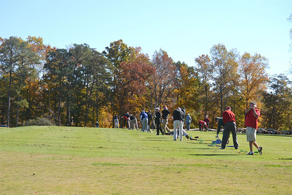 Golfers practicing 
